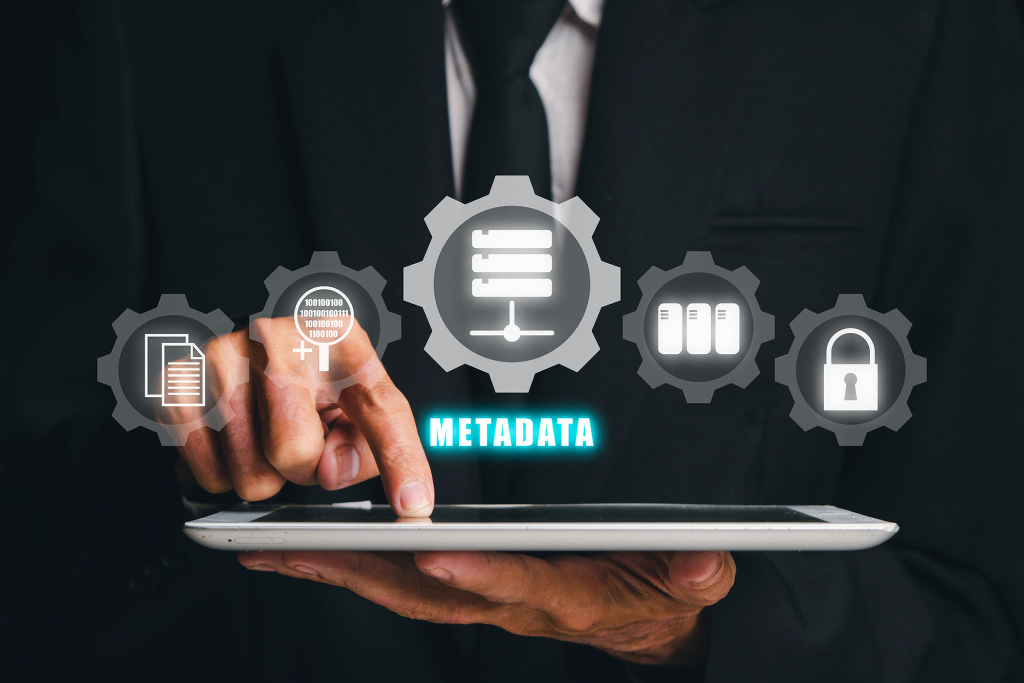 Metadata concept, Businessman touching on tablet with VR screen metadata icon on black background, Internet communication social network people concept.